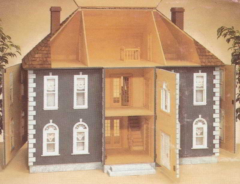 View of dollhouse with opened entrance panel